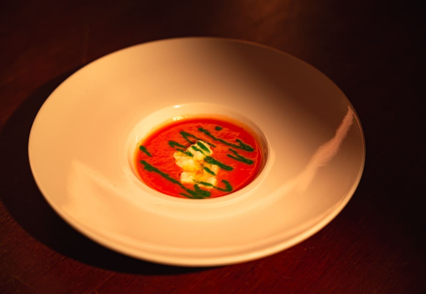 Crema di pomodoro con squacquerone e olio alle erbe